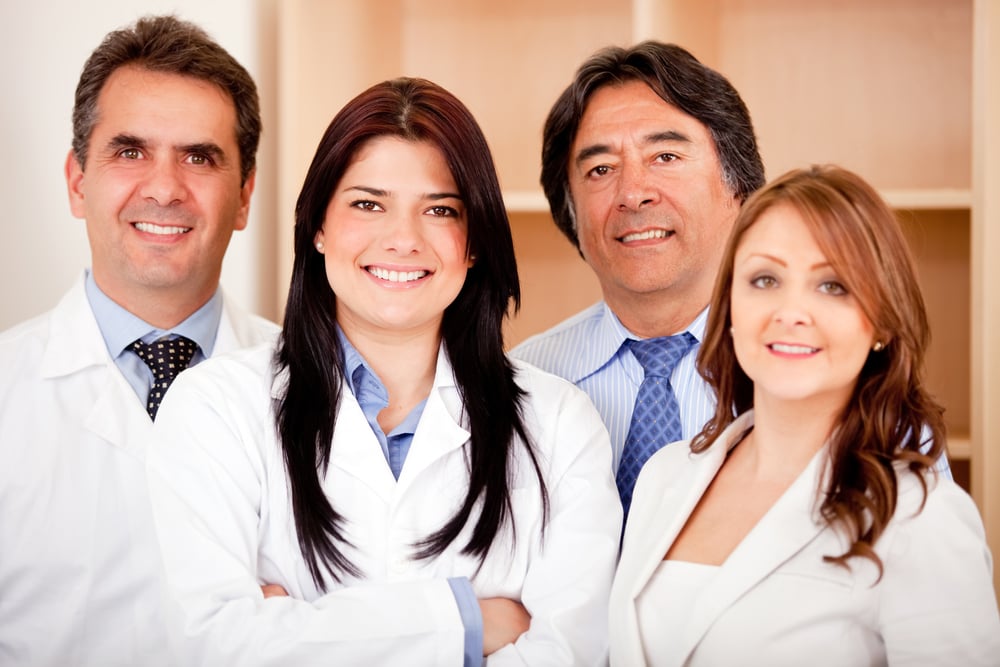 Business people and medical staff at the hospital smiling